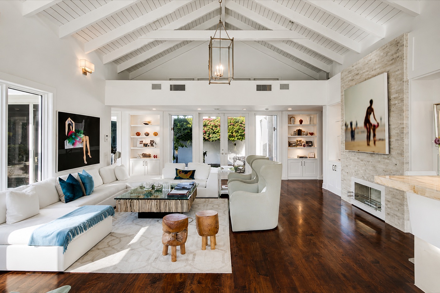 Vaulted, light-filled living room with custom millwork